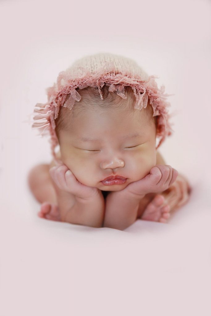 baby carly jazz doing a froggy pose for a newborn session