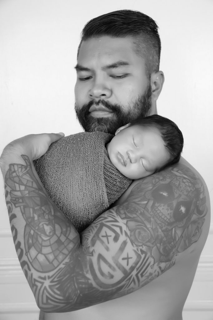 baby fort cyruz with his father Fortun Yalong ak.a. FCY Channel in a black-and-white newborn session